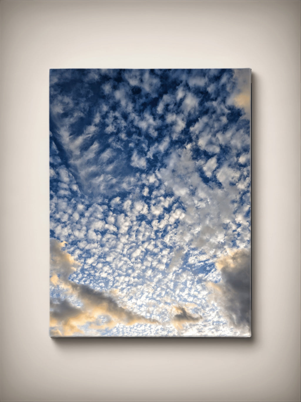 Stretched canvas print: blue cloudscape with bright golden glow, vertical square wall art