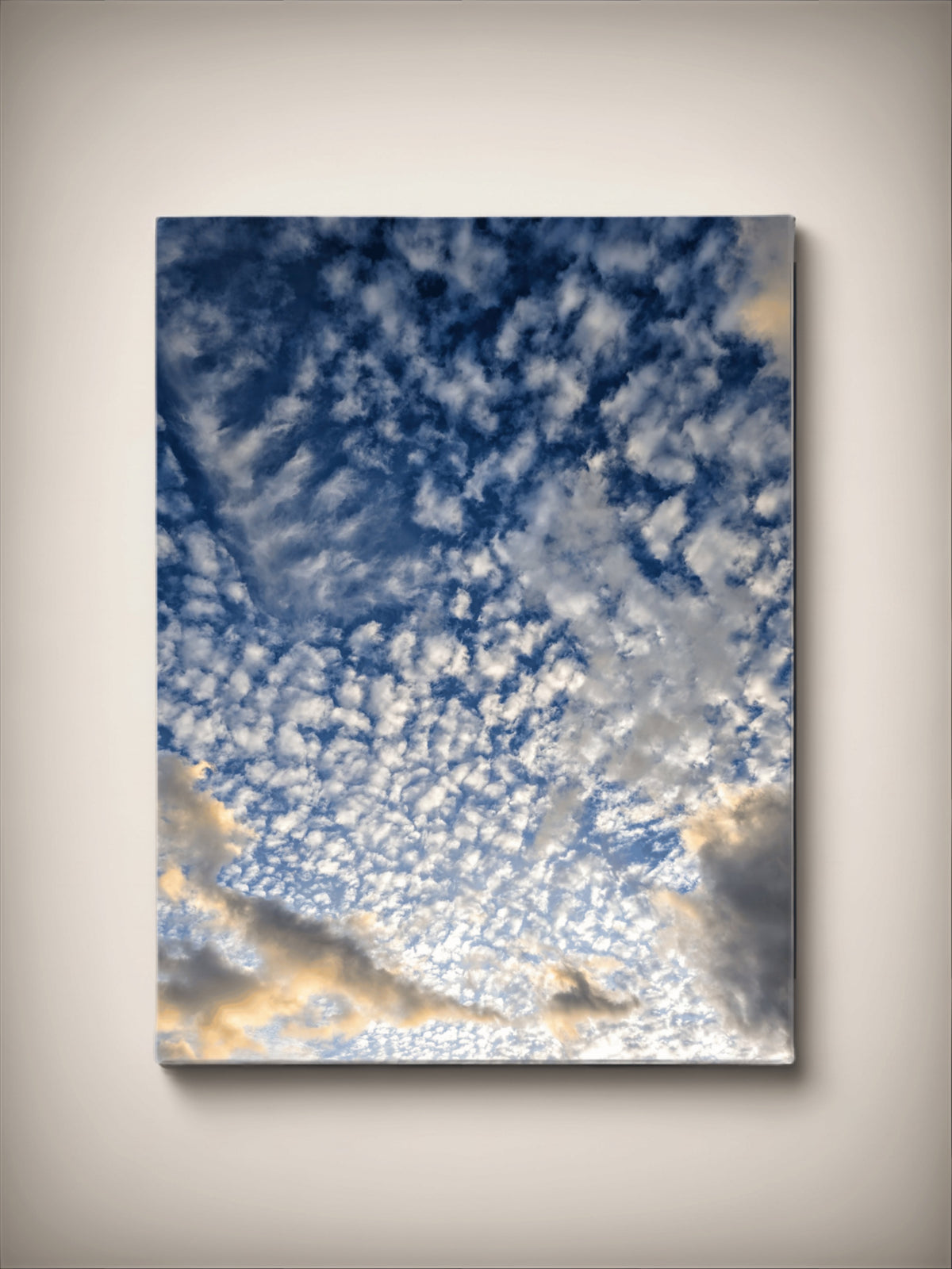 Stretched canvas print: blue cloudscape with bright golden glow, vertical square wall art