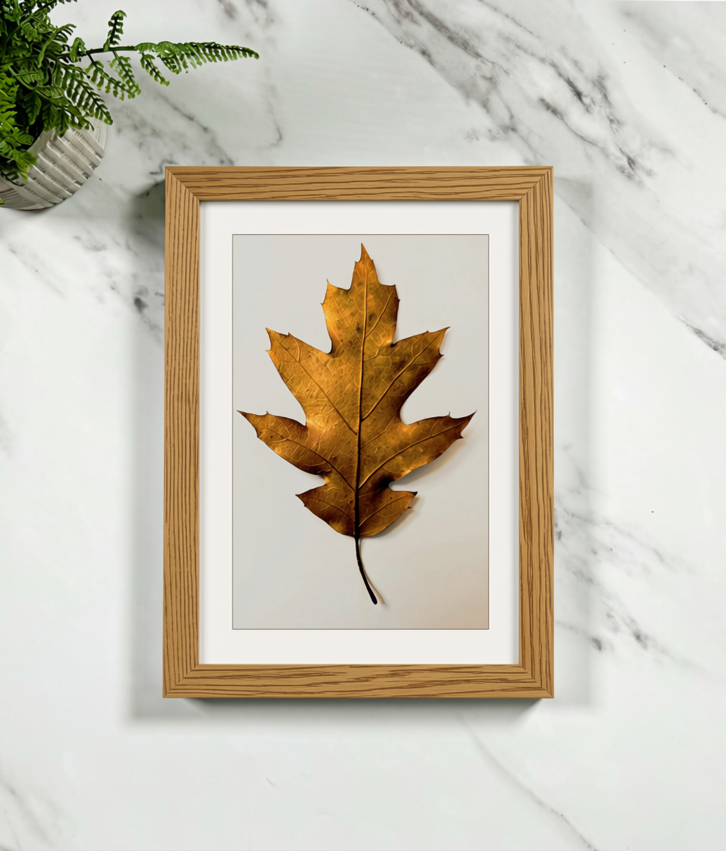 Framed leaf art print with gold-tone oak wooden frame and matte white mat