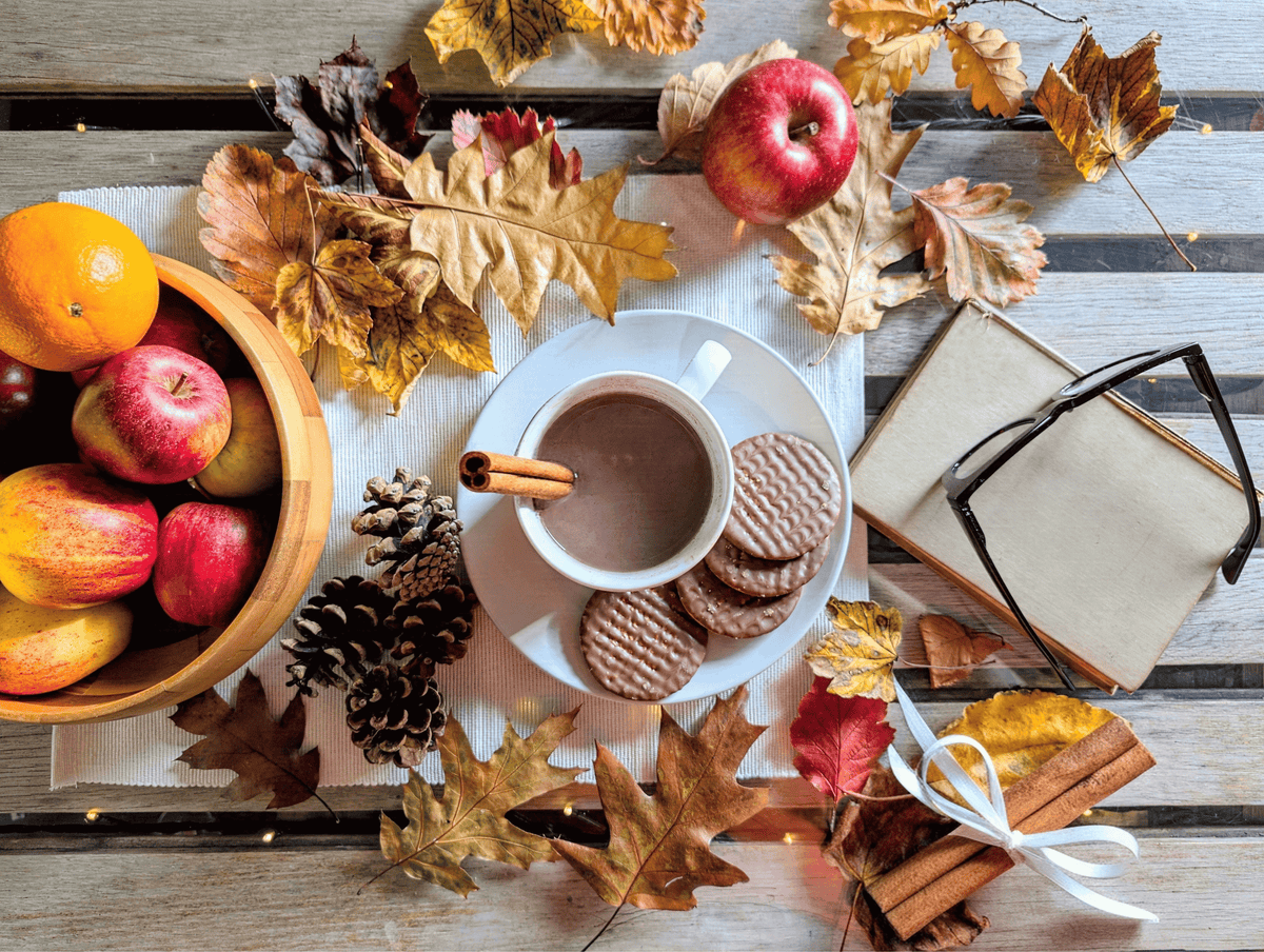 Autumn-themed framed artwork with cup of cocoa, apples, leaves, and cinnamon sticks