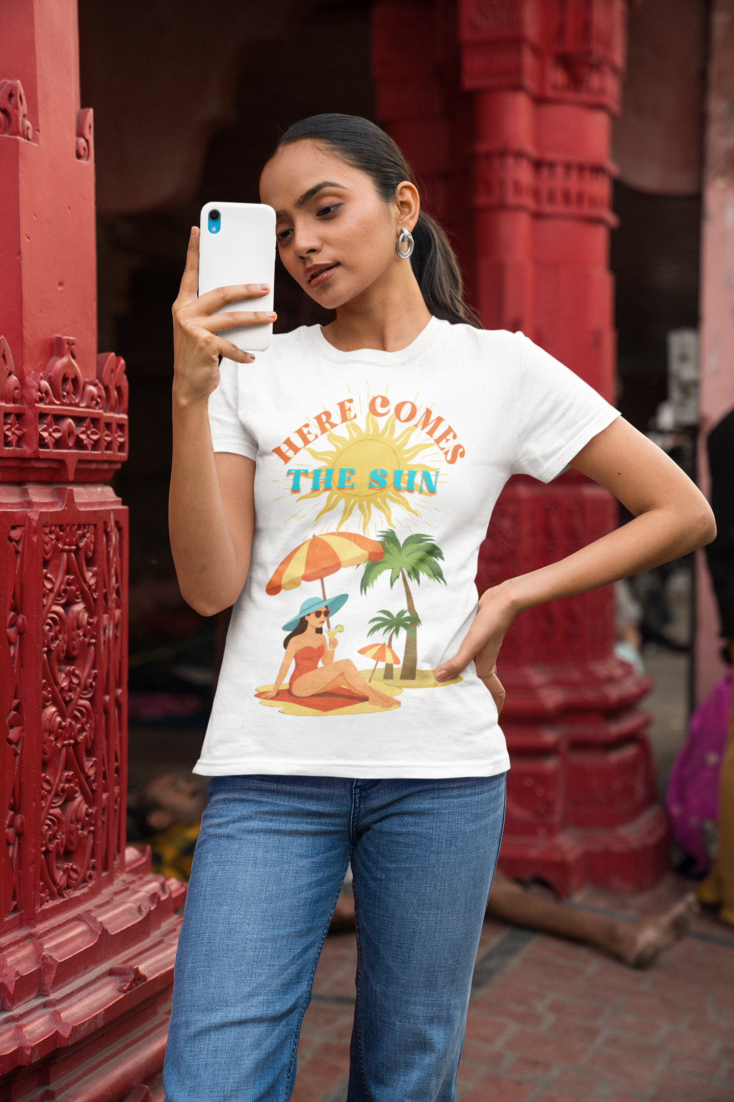 Here Comes the Sun T-shirt Gildan SoftStyle ladies fitted T-shirt. Lady wearing Here Comes the Sun design, ringspun cotton, white, front view
