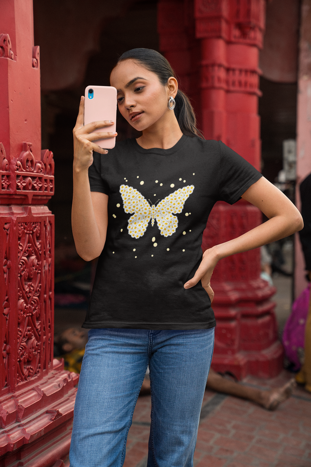 Women’s short-sleeve crewneck t-shirt, black, yellow butterfly daisy sparkle graphic.